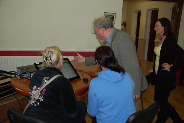 Councillor John Gilligan demonstrating DIEGO to a group of ladies in King Island Youth and Community Centre